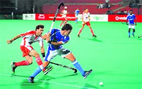 Players of Chandigarh Comets (Blue) and Mumbai Marines in action during their match in Chandigarh on Wednesday