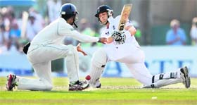 Jonathan Trott (R) plays a shot during the third day of the first Test against Sri Lanka in Galle on Wednesday