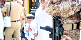 A schoolboy returns home in Patiala�s heavily guarded Arya Samaj area.
