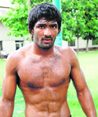 Yogeshwar Dutt (60kg) won a silver medal at the Asian Qualifying tournament in Astana.