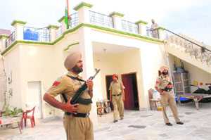 Tight security at complainant Kamaljit's house at Begowal village in Kapurthala.
