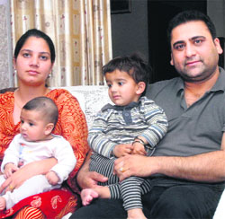Kamaljit Singh, his wife Nevia and sons Tejvir and Jaivir at his house in Begowal. 