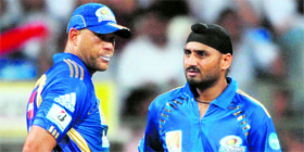 Harbhajan SIngh (R) with former teammate Andrew Symonds. Harbhajan led Mumbai Indians to the title in the Champions League last year in Sachin Tendulkar�s absence.