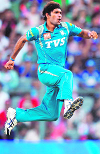 Pune Warriors� Ashok Dinda celebrates the wicket of Mumbai Indians� Ambati Rayudu during their match at the Wankhede Stadium in Mumbai on Friday