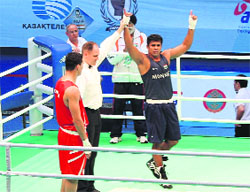 Manpreet Singh (R) celebrates after his win over Tulyek Yerbolat of Mongolia.
