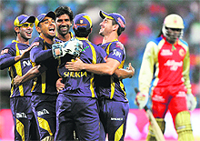 Kolkata Knight Riders celebrate the dismissal of Royal Challengers Bangalore�s Chris Gayle (R) during their match at the M. Chinnaswamy Stadium in Bangalore on Tuesday. Knight Riders won the match by 42 runs.