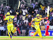 Chennai Super Kings' Ravindra Jadeja (R) and Dwayne Bravo celebrate after they won the match against RCB. 