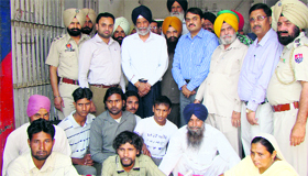 Punjab Rural Development and Panchayat Minister Surjit Singh Rakhra along with jail officials and the prisoners released from jail in Patiala on Monday.