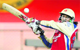 Royal Challengers Bangalore's Chris Gayle plays a shot against Pune Warriors at the M. Chinnaswamy Stadium in Bangalore on Tuesday. RCB won by six wickets.