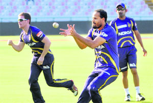 Yusuf Pathan takes a catch during practice as Gautam Gambhir (R) looks on. 