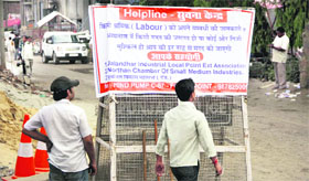 A helpline banner by industrialists at Focal Point in Jalandhar. 