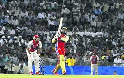 Royal Challengers Bangalore�s Chris Gayle hits a straight six to Harmeet Singh of Kings XI Punjab in Mohali 