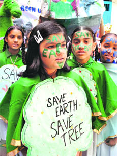 Schoolgirls take out an awareness rally on the eve of World Earth Day in Patiala on Saturday.
