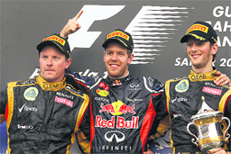Red Bull driver Sebastian Vettel of Germany (center), second placed Lotus driver Kimi Raikkonen of Finlan (left) and Lotus driver Romain Grosjean of France stand on the podium after the Bahrain Formula One Grand Prix in Sakhir on Sunday. 