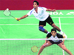 India�s Ashwini Ponnappa and Tarun Kona in action during their mix-doubles match at Yonex Sunrise India Open in New Delhi on Wednesday