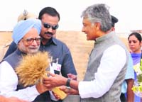 CLP leader Sunil Jakhar greets PM Manmohan Singh at IAF�s Bhisiana base near Bathinda.