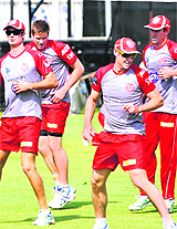 Kings XI Punjab players warmup during a training session in Mohali on Friday.
