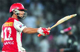 Kings XI Punjab's Mandeep Singh raises his bat after scoring a fifty during their match against Deccan Chargers in Hyderabad on Tuesday. Kings won by 25 runs