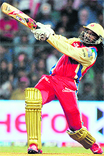 Royal Challengers Bangalore�s Chris Gayle plays a shot during their match against Mumbai Indians at The Wankhede Stadium in Mumbai on Wednesday. Royal Challengers Bangalore won by nine wickets
