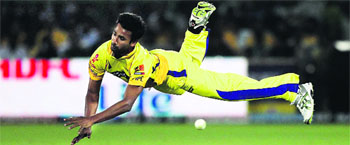 Chennai Super Kings' Yo Mahesh dives to stop the ball during their match against Rajasthan Royals in Jaipur on Thursday. Chennai Super Kings won by four wickets. 