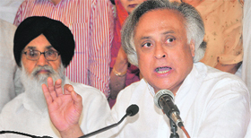 Union Minister Jairam Ramesh speaks to mediapersons in Chandigarh on Saturday. Punjab Chief Minister Parkash Singh Badal is also seen.