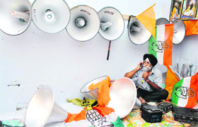 A shopkeeper with campaign material for the coming MC elections in Patiala on Saturday.