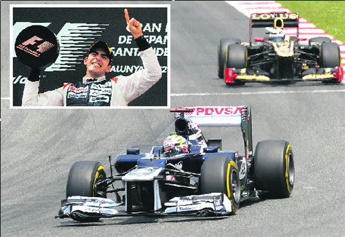 Williams Formula One driver Pastor Maldonado (inset) drives ahead of Lotus� Kimi Raikkonen at the Spanish Grand Prix near Barcelona on Sunday