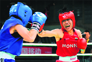 Mary Kom (R) of India fights with Japan's Ayako Minnowa at the World Women's Boxing Championship in Qinhuangdao, China on Sunday. 