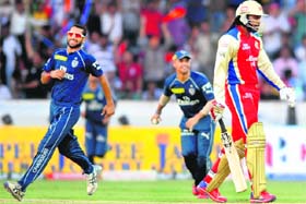 END OF A CHALLENGE: Chris Gayle of Royal Challengers Bangalore walks back after his dismissal during the match against Deccan Chargers in Hyderabad on Sunday