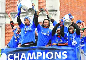 CELEBRATING MAIDEN TITLE: (From left) Chelsea�s Ashley Cole, Didier Drogba, Jose Bosingwa, Salomon Kalou and John Obi Mikel celebrate during an open top bus victory parade in London on Sunday