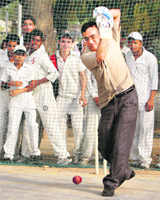 Sports Minister Ajay Maken bats during a visit to Major Dhyanchand National Stadium in New Delhi on Tuesday. He visited some stadiums to review the �Come out and Play� scheme.