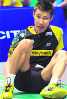 World number one Lee Chong Wei of Malaysia reacts after an ankle injury during a match at the Thomas Cup world badminton team championship in Wuhan. 