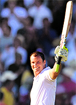 England captain Andrew Strauss celebrates his century during the second Test against the West Indies in Nottingham on Saturday