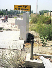 A damaged hand pump near the railway station.