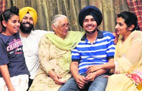 Sweet success: Ishkiran with his family in Mohali