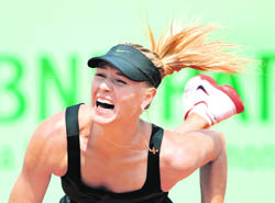 Maria Sharapova serves to Alexandra Cadantu during their match at the Roland Garros stadium in Paris on Tuesday. 