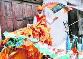 A vendor selling election material of various parties in Patiala