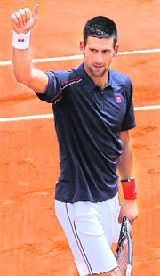 Novak Djokovic celebrates after winning against Blaz Kavcic during their 2nd Round match at the Roland Garros stadium in Paris on Wednesday. 