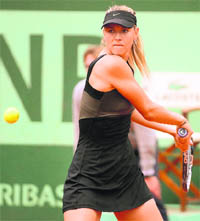 Maria Sharapova hits a return to Ayumi Morita at the Roland Garros in Paris on Friday. 