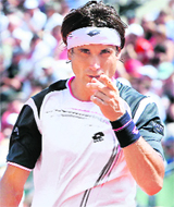 David Ferrer reacts after winning a point against Mikhail Youzhny in Paris on Saturday.