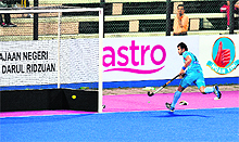 Tushar Khandker scores a goal against Britain during a third place play-off match in Ipoh