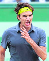 Roger Federer reacts during his match against Juan Martin Del Potro in Paris on Tuesday. Federer won 3-6, 6-7, 6-2, 6-0, 6-3