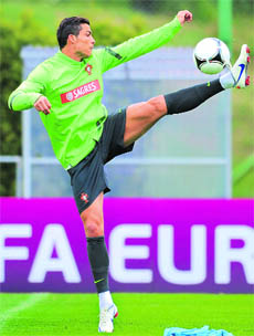 Portugal's Cristiano Ronaldo controls the ball during a training session in Opalenica ahead of their match against Germany. 