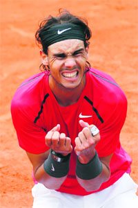 Rafael Nadal celebrates after winning against Novak Djokovic in Paris on Monday