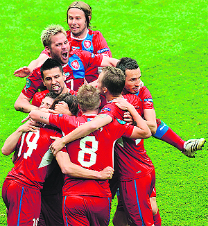 Czech Republic players celebrate after scoring during their match against Greece at the Municipal Stadium in Wroclaw on Tuesday. Czechs won 2-1. 