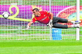 Portugal's Eduardo tries to catch the ball during a training session in Opalenica.