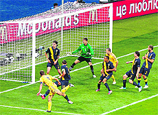 Ukraine's Andriy Shevchenko (L) scores his second goal against Sweden in Kiev on Monday. 