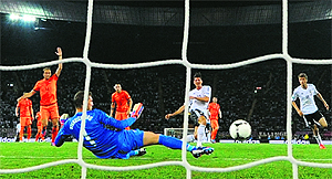 German forward Mario Gomez scores the opening goal against the Netherlands at the Metalist Stadium in Kharkiv on Wednesday