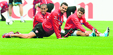 Czech players Theodor Gebre Selassie, Tomas Sivok and Vaclav Pilar stretch during a training session in Wroclaw ahead of their match against Poland. 