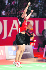 Saina Nehwal exults after defeating China's Li Xuerui in the final of the Indonesia Open in Jakarta. 